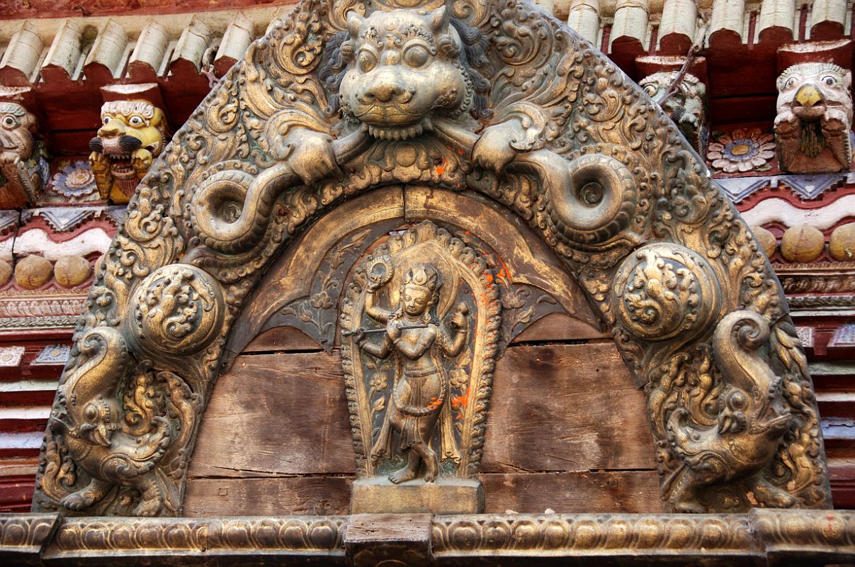 Kathmandu Changu Narayan 28 Krisha Plays the Flute On The Torana Above The North Entrance To The Changu Narayan Temple Krishna plays the flute on the torana above the north entrance to Changu Narayan Temple. In his other two hands, Krishna holds the discus and the conch, symbols of Vishnu.